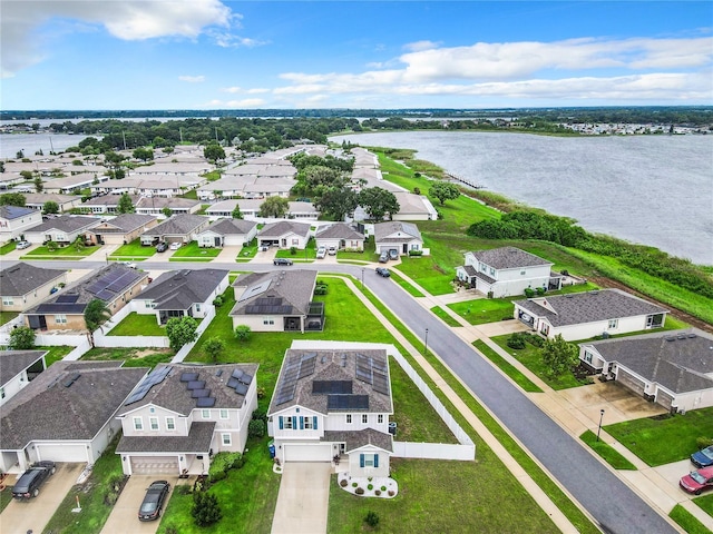 bird's eye view featuring a water view and a residential view