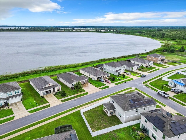 aerial view featuring a water view and a residential view