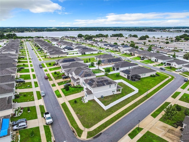 birds eye view of property featuring a water view and a residential view