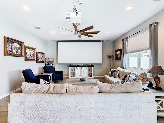 home theater room with baseboards, visible vents, and recessed lighting