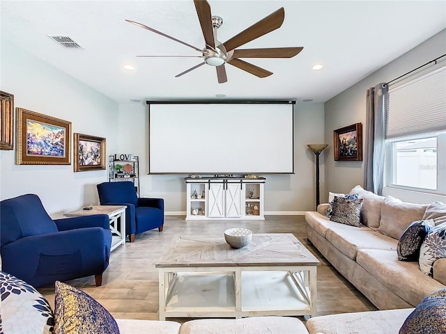 cinema featuring baseboards, a ceiling fan, visible vents, and recessed lighting