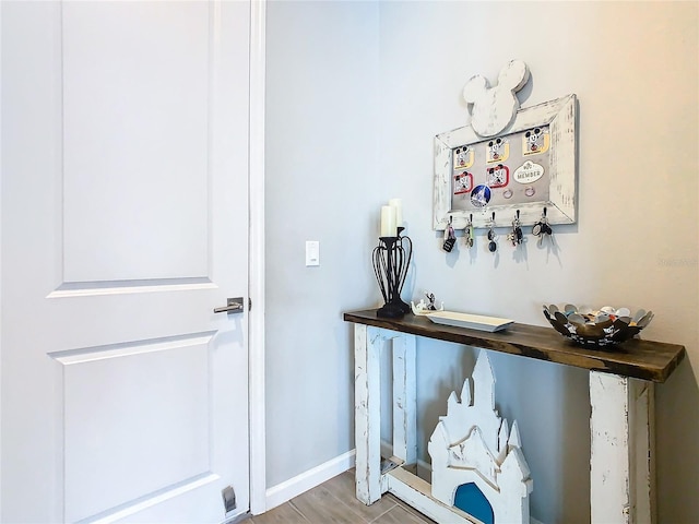 interior space featuring baseboards and wood finished floors