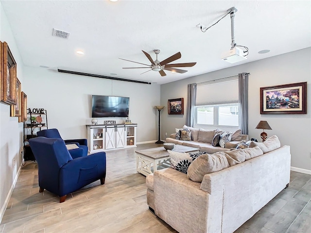 living area with ceiling fan, recessed lighting, wood finished floors, visible vents, and baseboards