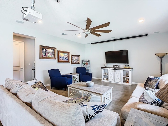 living area with baseboards, visible vents, ceiling fan, wood finished floors, and recessed lighting