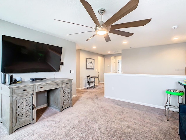 living room with recessed lighting, light colored carpet, a ceiling fan, and baseboards