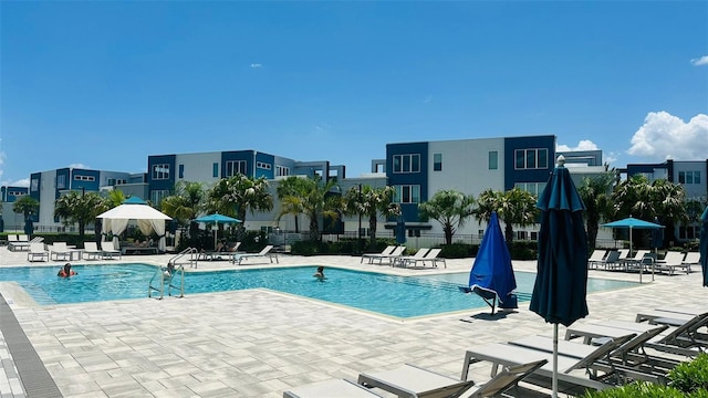 view of swimming pool with a patio