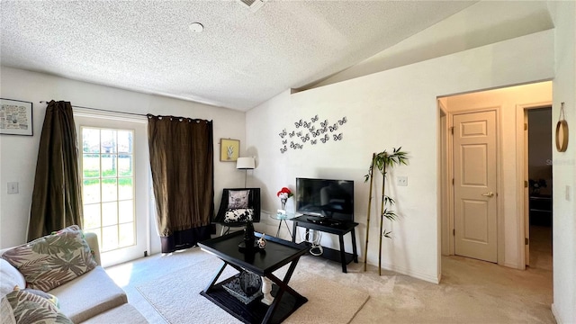 living room with vaulted ceiling, light carpet, and a textured ceiling