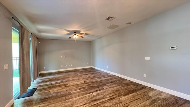 unfurnished room featuring dark hardwood / wood-style floors and ceiling fan