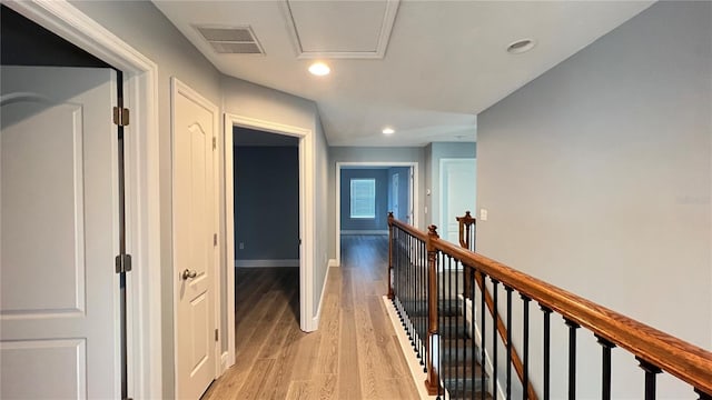 corridor with light wood-type flooring