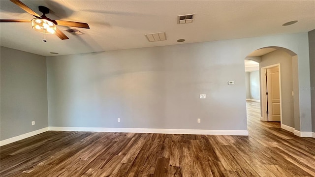 empty room featuring hardwood / wood-style flooring and ceiling fan