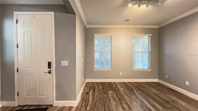 foyer featuring dark hardwood / wood-style flooring and ornamental molding