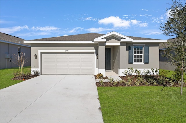 ranch-style house with a garage and a front yard