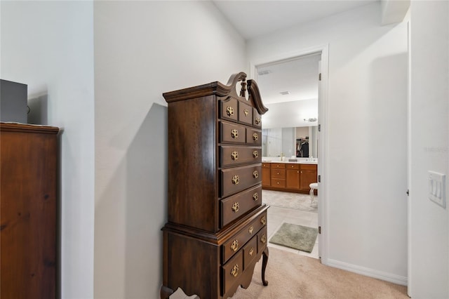 742 San Joaquin Rd, Poinciana, FL 34759 - hallway featuring baseboards and light colored carpet