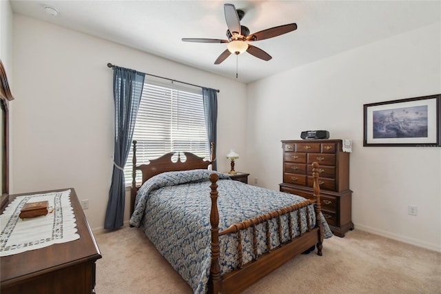 bedroom featuring ceiling fan and light colored carpet