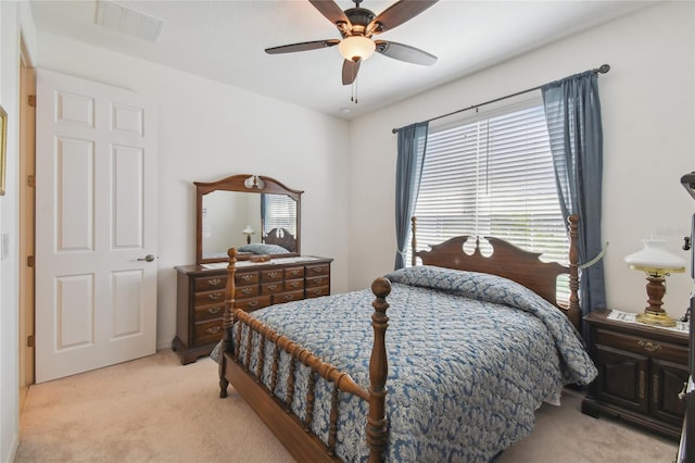 carpeted bedroom with ceiling fan