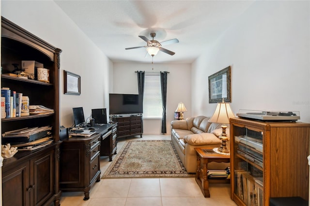 interior space featuring light tile patterned floors and ceiling fan