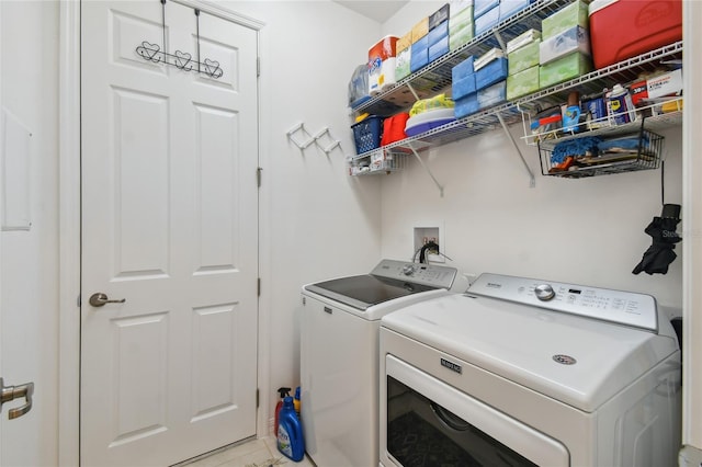 washroom with separate washer and dryer