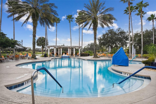 view of pool featuring a pergola and a patio