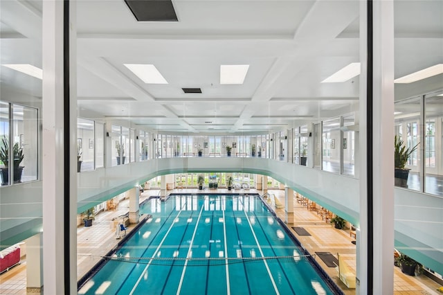 view of swimming pool with a skylight