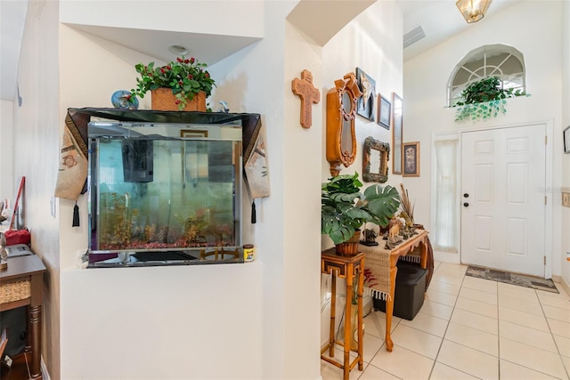 foyer entrance featuring light tile patterned flooring