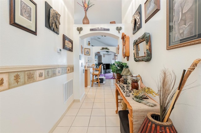 hallway featuring light tile patterned floors