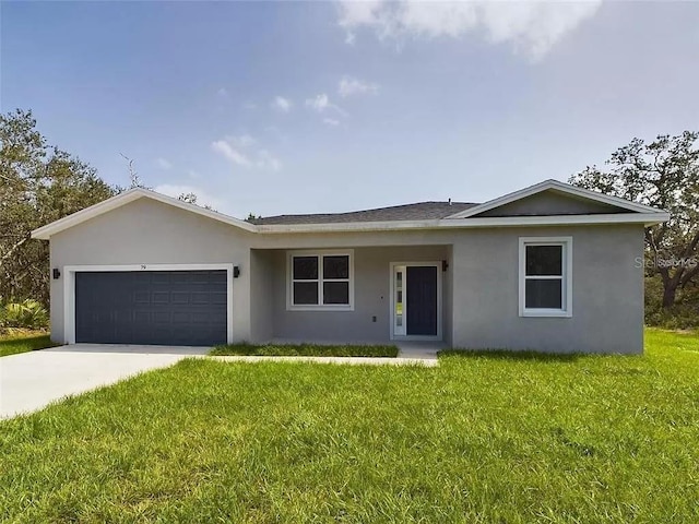 ranch-style house featuring a garage and a front yard