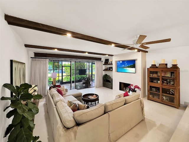 living room featuring a fireplace, beamed ceiling, and ceiling fan