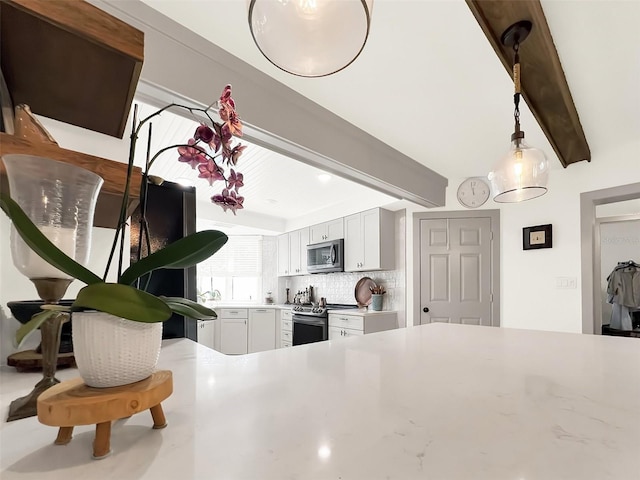 kitchen featuring white cabinets, appliances with stainless steel finishes, beamed ceiling, decorative light fixtures, and backsplash