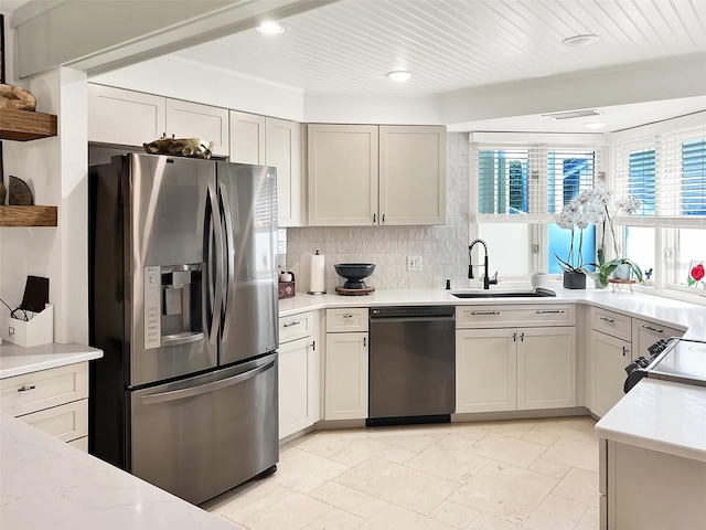 kitchen with wooden ceiling, a sink, appliances with stainless steel finishes, decorative backsplash, and open shelves