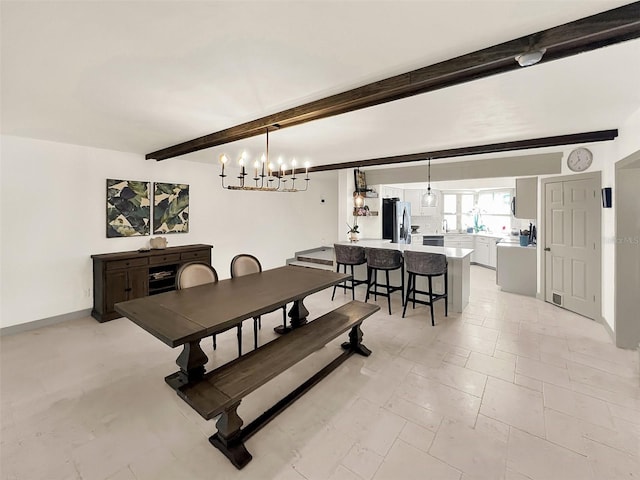 dining space featuring an inviting chandelier, beam ceiling, and baseboards