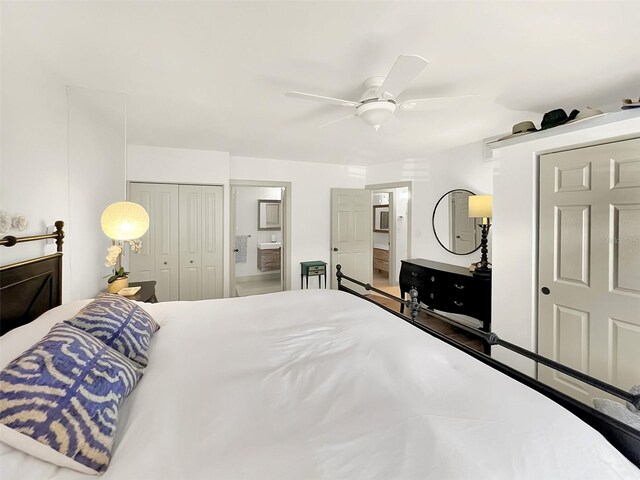 bedroom featuring ensuite bath, ceiling fan, and a closet