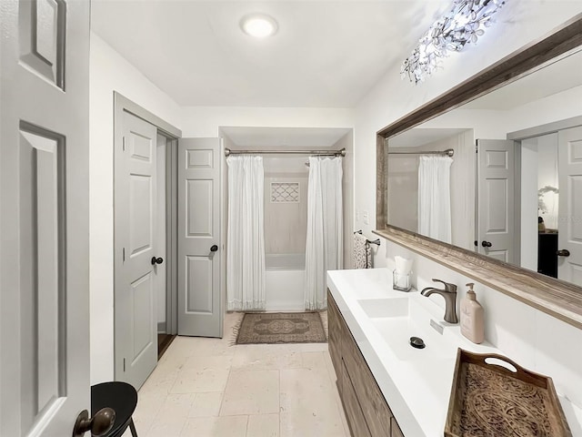 full bath featuring shower / bath combo with shower curtain and vanity