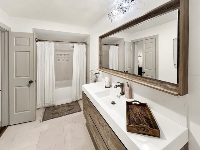 bathroom featuring shower / tub combo, marble finish floor, and vanity