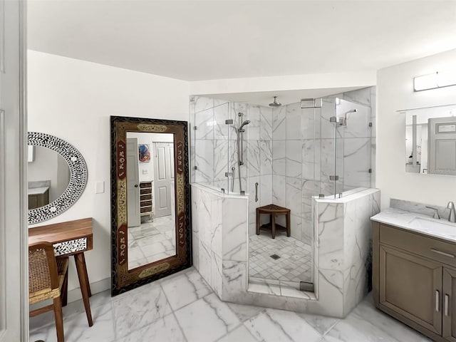 bathroom featuring marble finish floor, a marble finish shower, and vanity