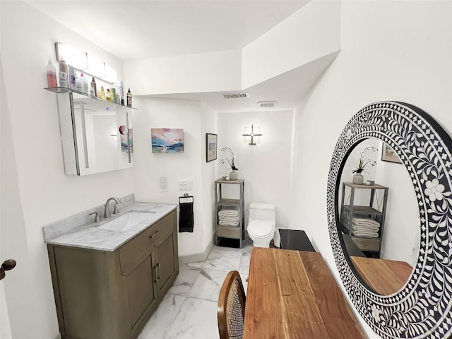 bathroom with toilet, marble finish floor, visible vents, and vanity