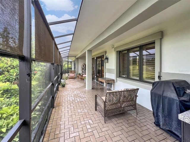 view of patio / terrace featuring a lanai and grilling area