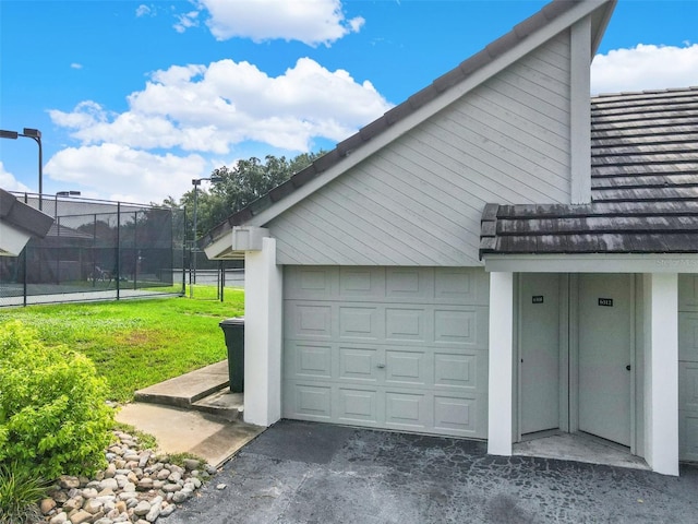 garage featuring fence