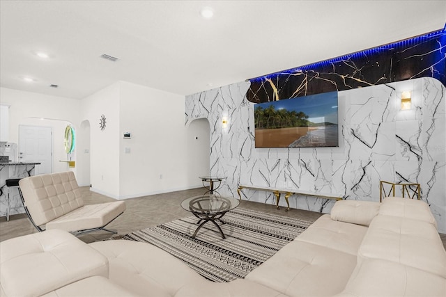 living room with tile patterned flooring