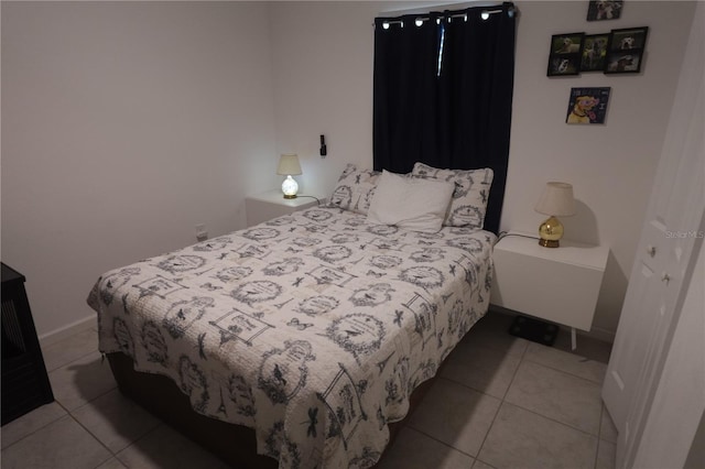 bedroom featuring light tile patterned floors