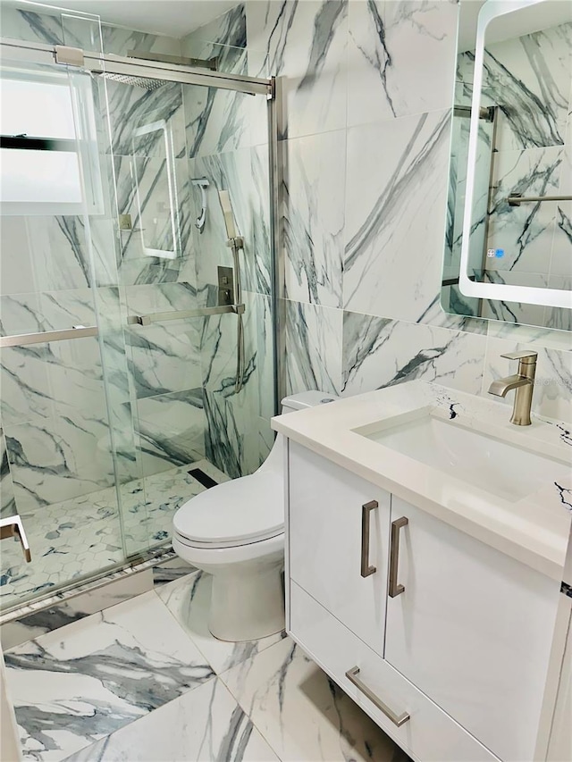 bathroom featuring vanity, tile walls, toilet, and walk in shower