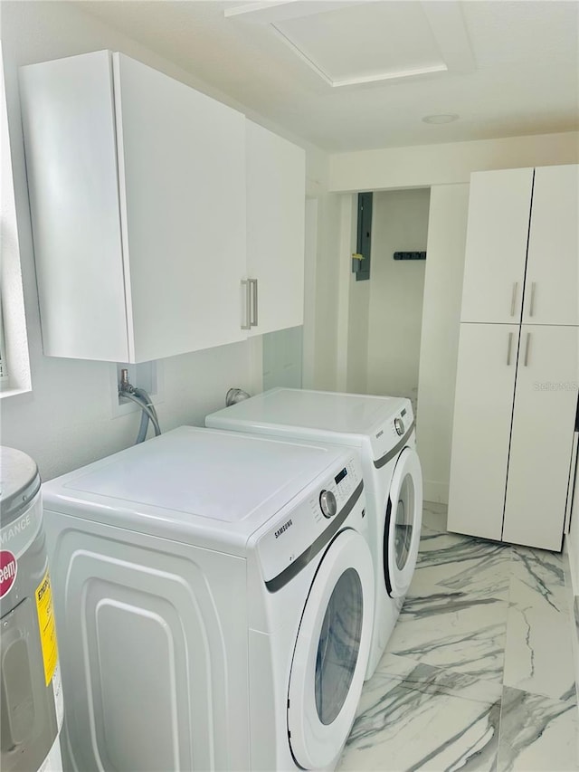 laundry room with cabinets and washing machine and dryer