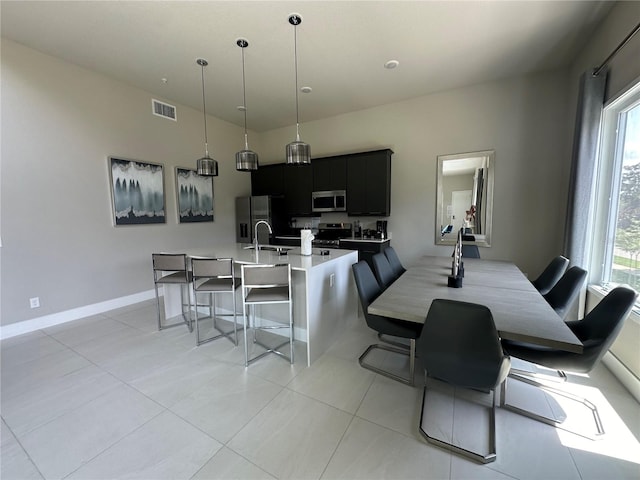 tiled dining room with sink