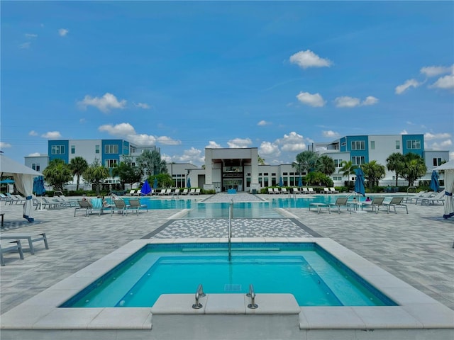 pool with a patio area