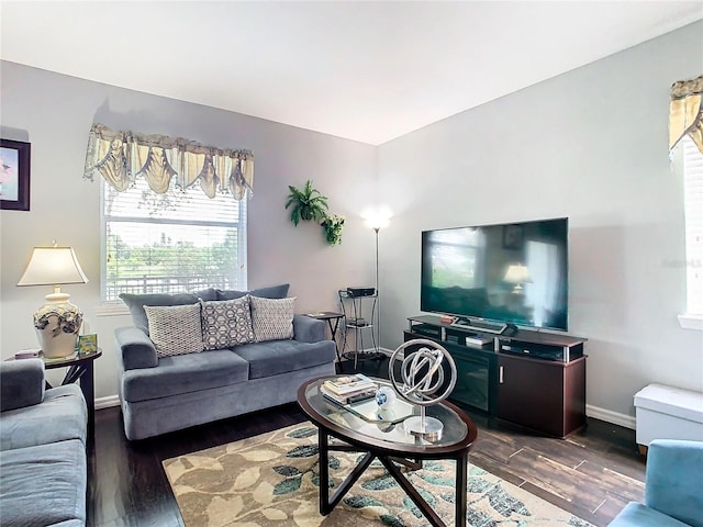 living room with dark wood-style floors and baseboards