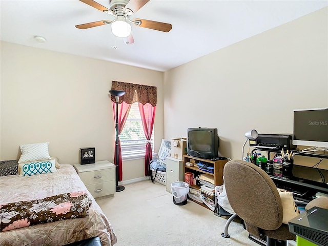 bedroom featuring ceiling fan, baseboards, and light colored carpet