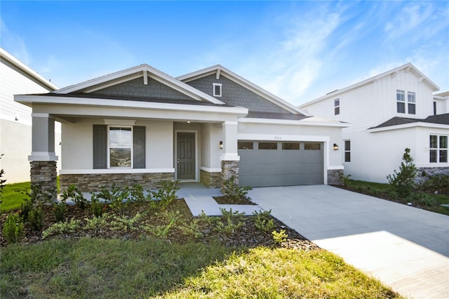 view of front of home with a porch and a garage