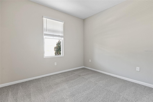 unfurnished room with carpet flooring