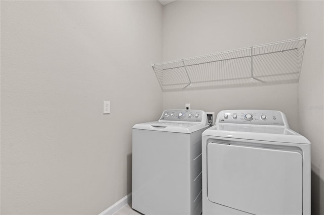 washroom featuring washer and dryer