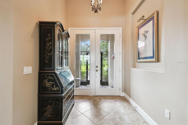 tiled foyer entrance with french doors