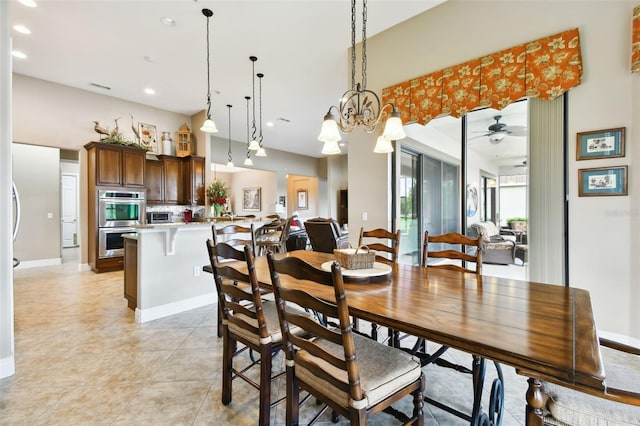 tiled dining space with ceiling fan